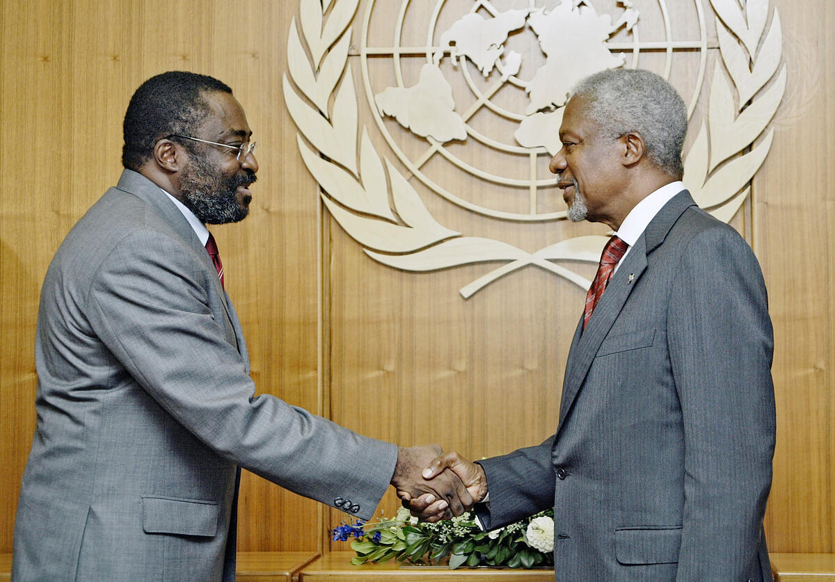Miguel Abia shaking hand with official